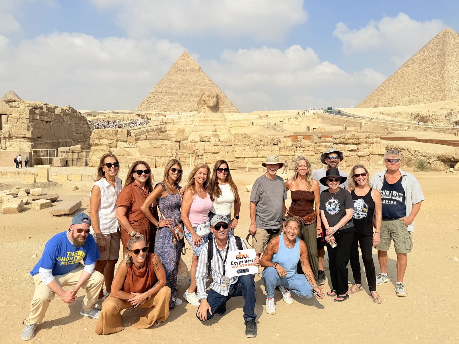 Egypt Best Vacations group with their guide in front of the Sphinx and the Giza Pyramids